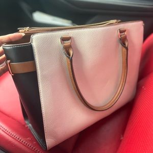 Black, cream, and brown bag